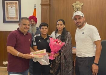 Deputy Commissioner Sakshi Sawhney pats young cricketer Kanika Ahuja for her selection in Indian women’s cricket squad