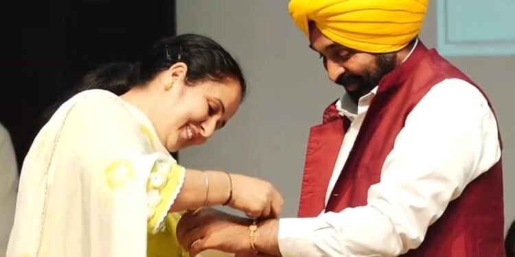 woman gets up on stage to tie Rakhi Punjab CM Bhagwant Mann