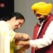 woman gets up on stage to tie Rakhi Punjab CM Bhagwant Mann