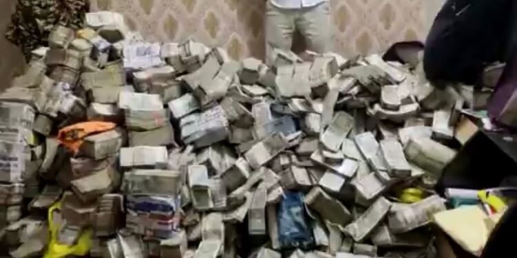 The recovered cash was described as a ‘mini mountain’ by officials.