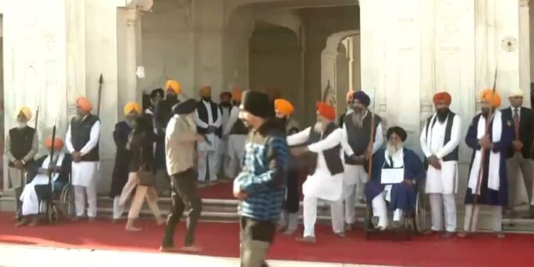 Man fires Sukhbir Singh Badal while he was engaged in a spiritual practice at the Golden Temple in Punjab.